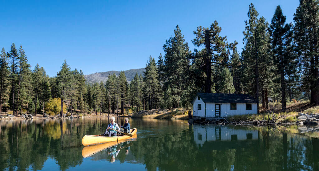 couple canoeing near lake tahe in fall