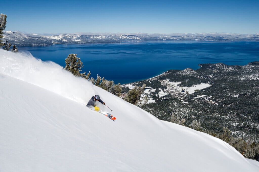 A skier overlooking Lake Tahoe at Heavenly Mountain Resort
