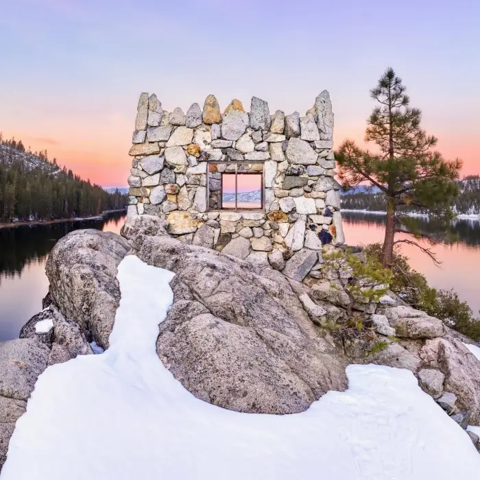 Looking through the window of Teahouse in Emerald Bay during sunset with snow on ground